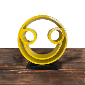 Yellow circular Tube Dude smiley face sculpture on black base